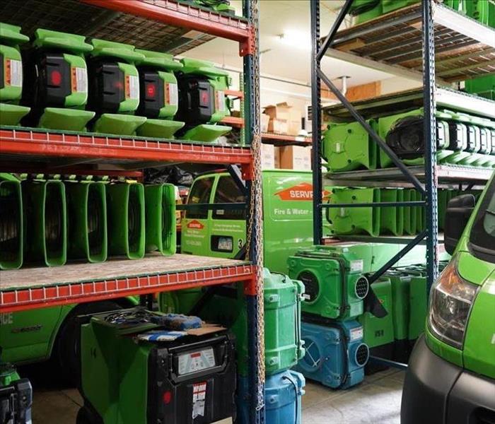 This is a picture of SERVPRO equipment on shelves ready to use. 